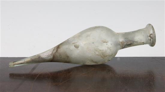 A Roman clear glass spindle flask, c.2nd century AD, 20cm